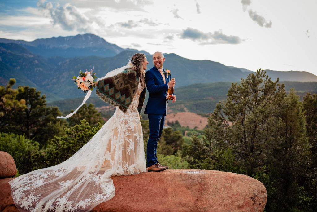 Celebrating their marriage on top of a rock at Garden of the Gods