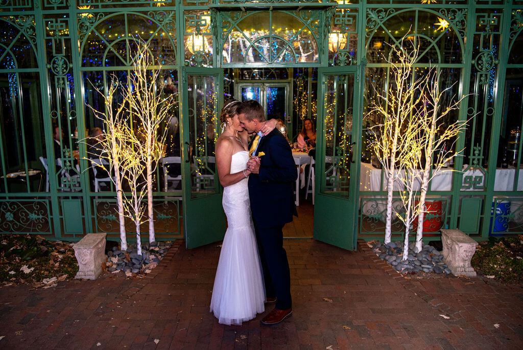 couple slow dance in the Denver Botanic Gardens after their wedding