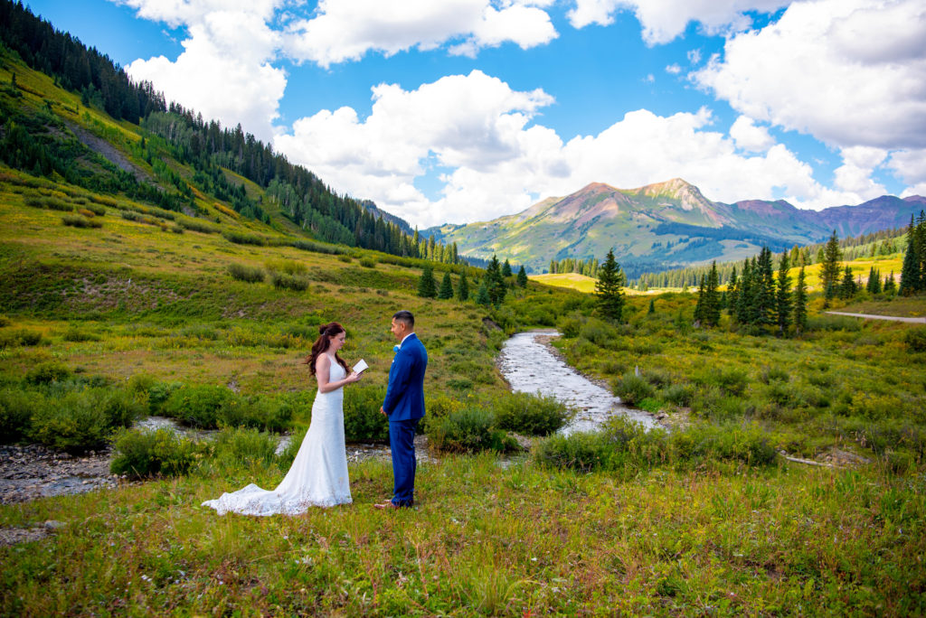 Bride and Groom read their vows during their elopement in Crested Butte 