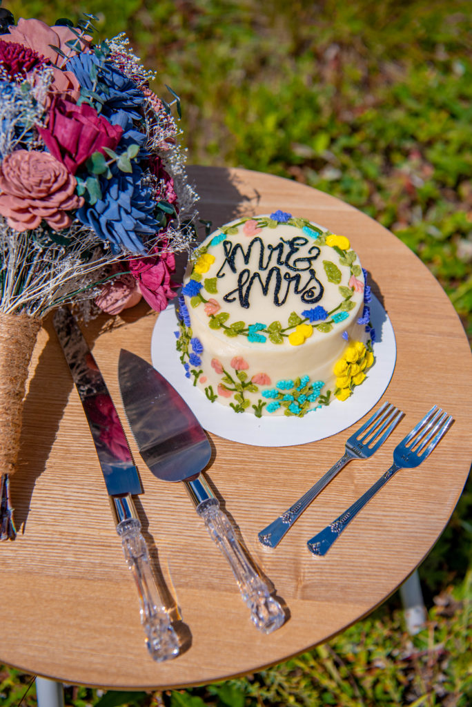 a wedding cake on a table for a Crested Butte elopement 