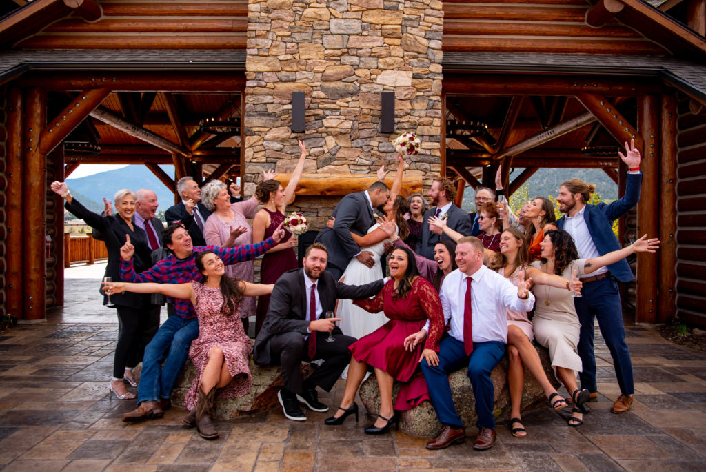 family is included in this elopement and cheers for bride and groom after their ceremony.