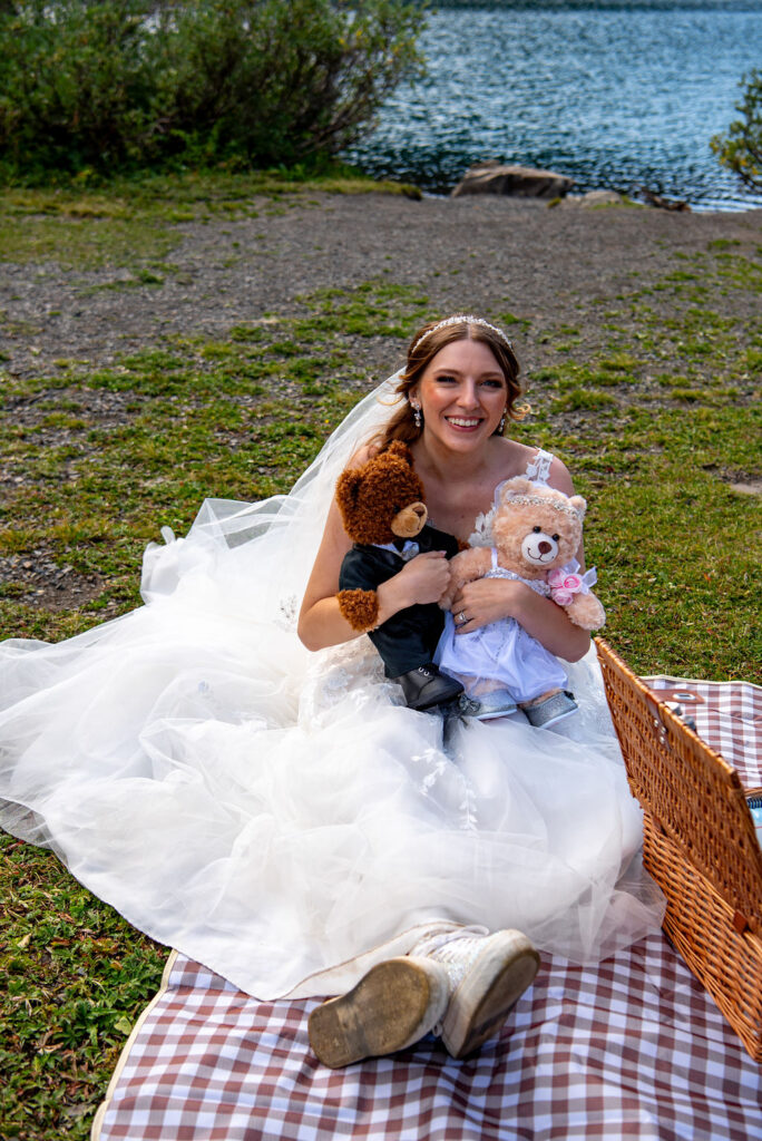 bride holding two wedding theme build-a-bears