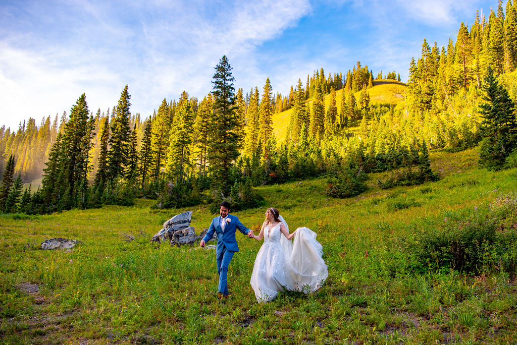 romantic bride and groom dancing in a wildflower field in crested butte