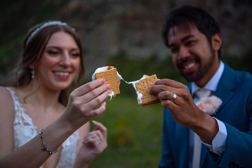 bride and groom making s'mores during their adventure elopement in crested butte