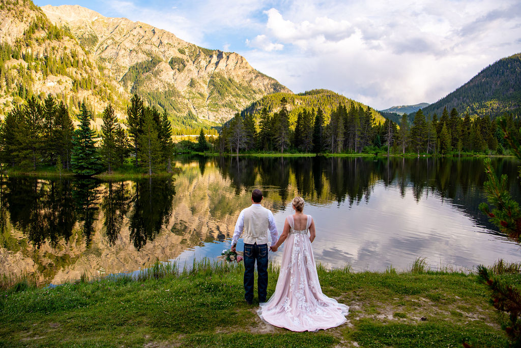 bride and groom looking at the colorado mountain views