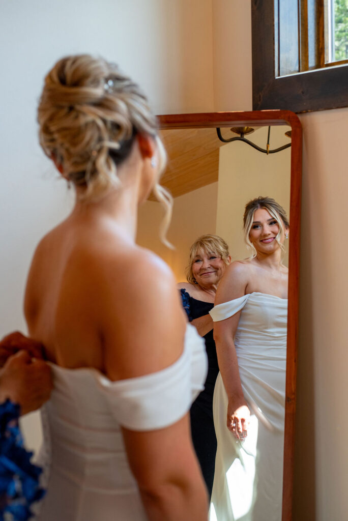 bride getting ready by the mirror