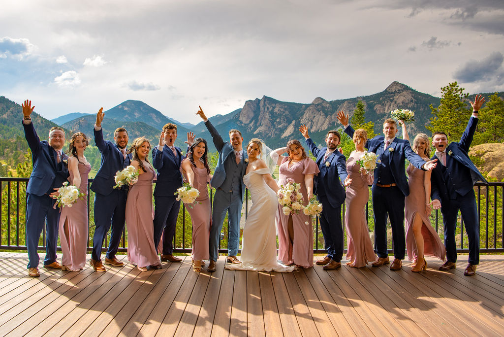 bride and groom and their wedding party with stunning Colorado mountain views in the backdrop