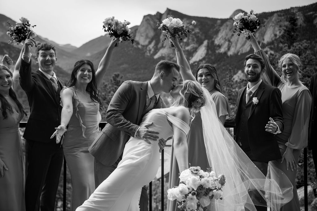 bride and groom and their wedding party with stunning Colorado mountain views in the backdrop