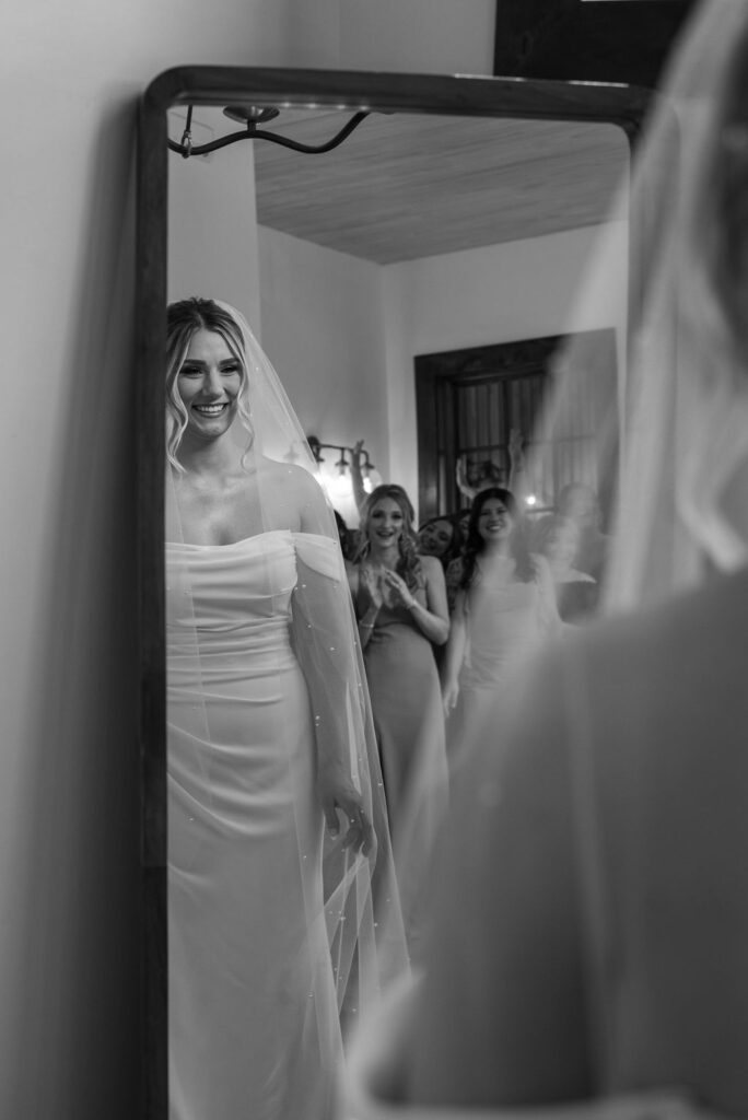 bride getting ready by the mirror