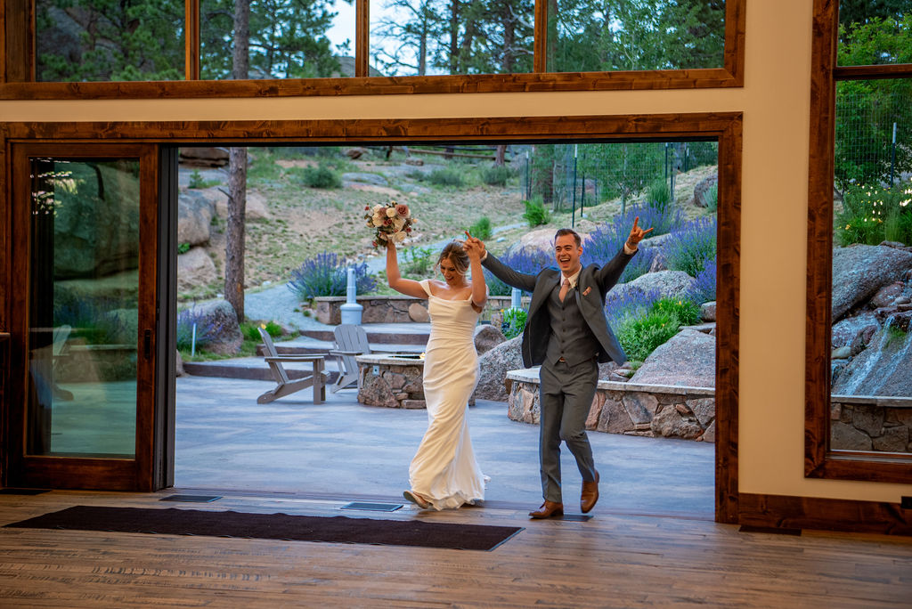 bride and groom entering the reception during the wedding at black canyon inn