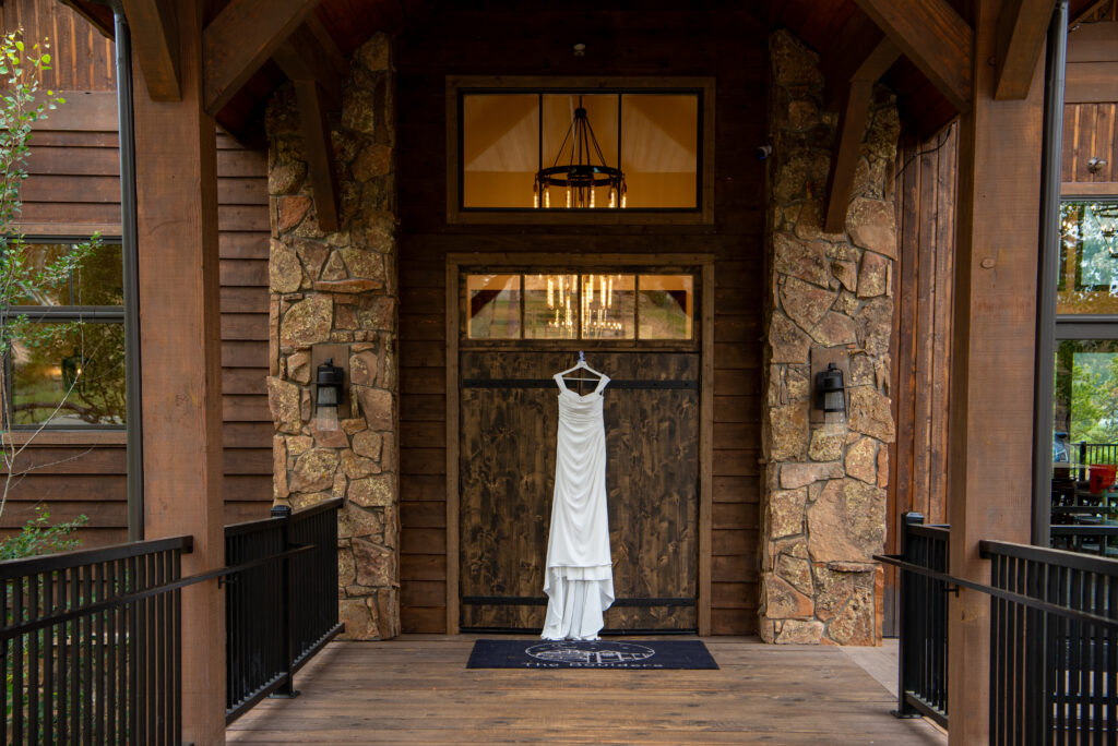 wedding dress hanging outside a Colorado wedding venue